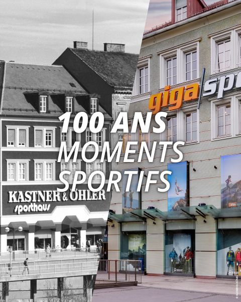 Image divisée montrant le même bâtiment à deux époques différentes : côté gauche en noir et blanc avec l'enseigne "Kastner & Öhler Sporthaus", côté droit en couleur avec l'enseigne "giga sport". Le texte superposé est "100 ANS MOMENTS SPORTIFS".